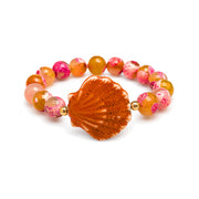 Calista Ceramic Shell Gemstone Bracelet in Sunset Coral with orange faceted gemstone beads and glazed ceramic shell centerpiece