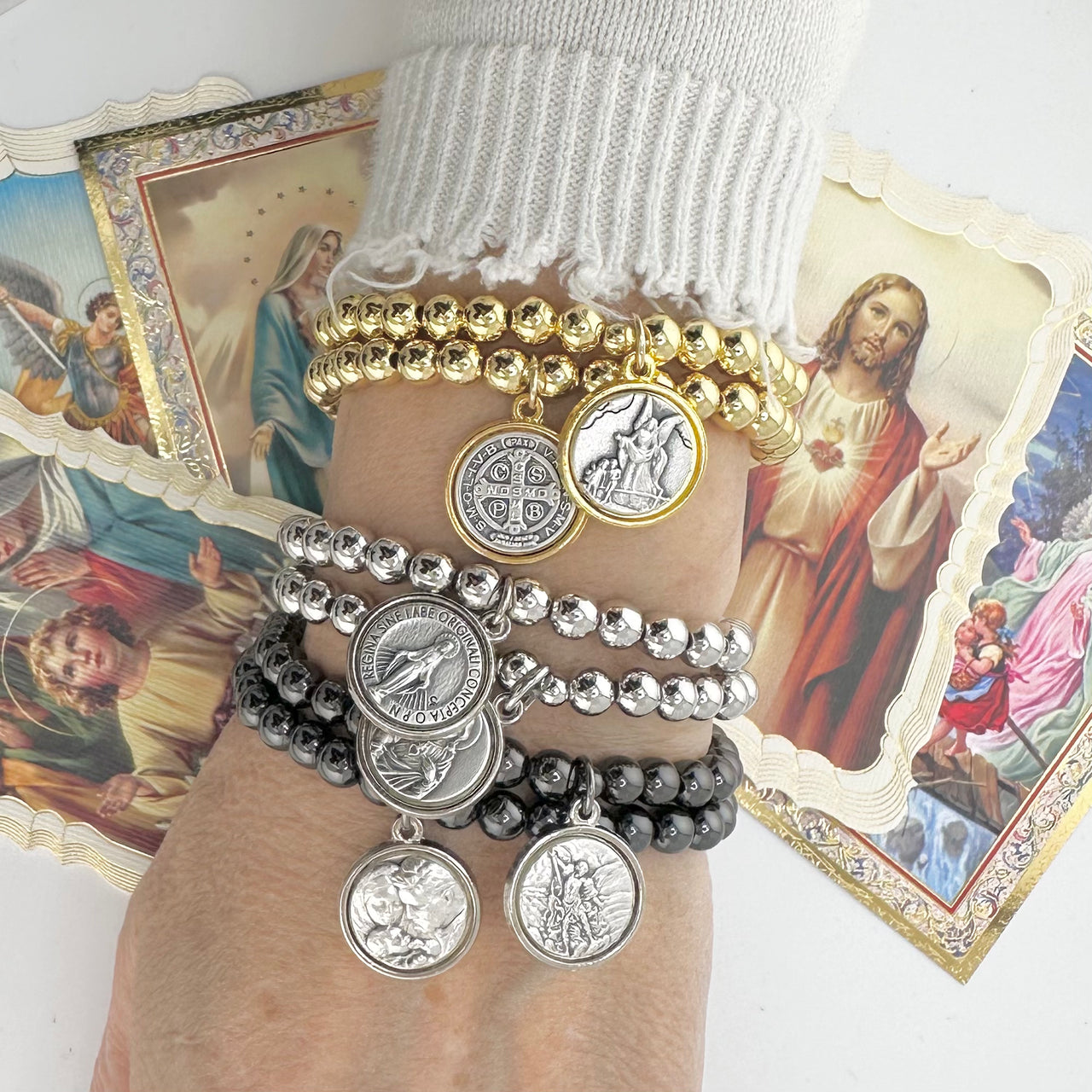 catholic medal saint beaded bracelet stacked gold and silver saint bracelets worn on wrist by love lisa jewelry