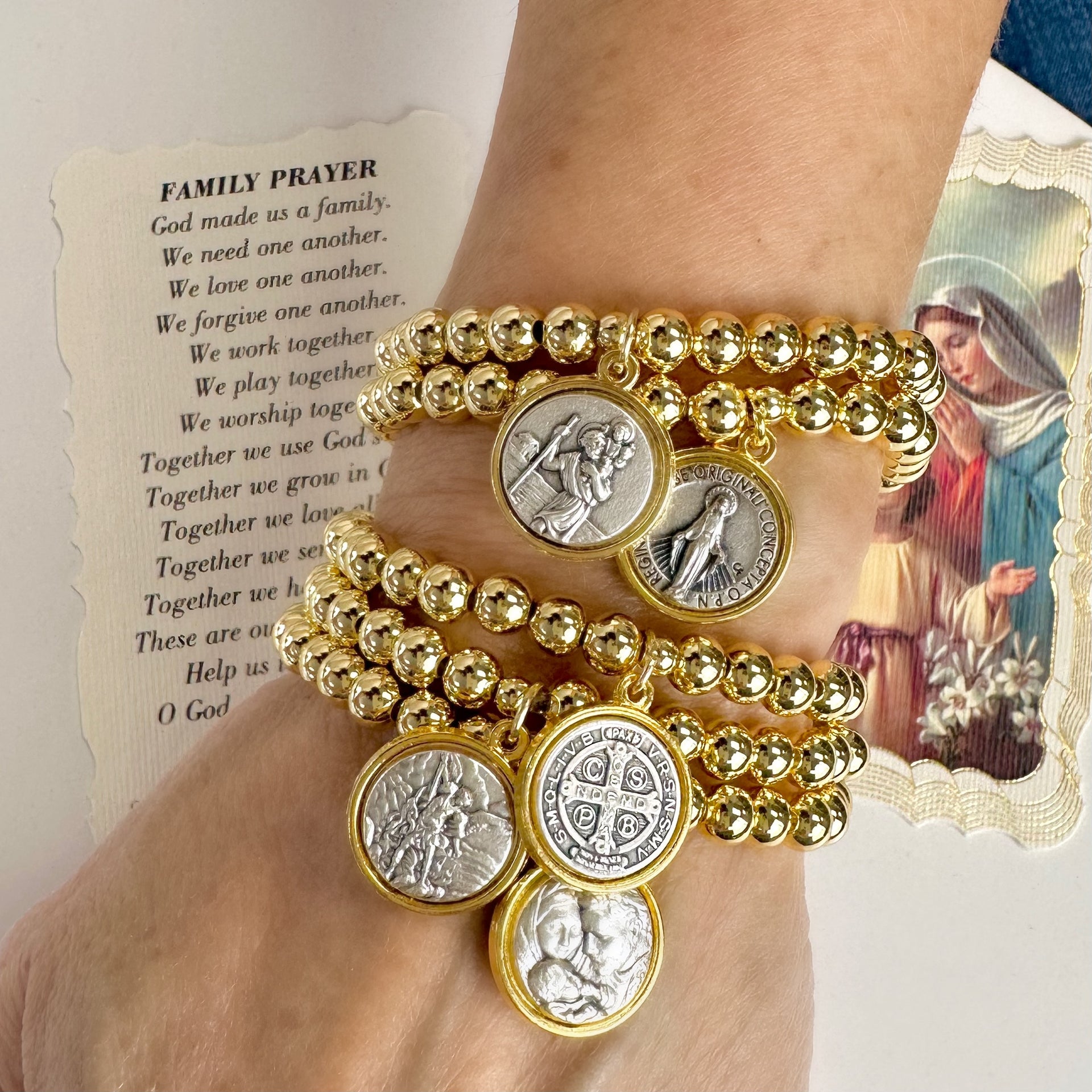 catholic medal saint beaded bracelet stacked gold and silver saint bracelets worn on wrist by love lisa jewelry