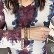 Love Lisa Celebrity Five beaded bracelet stack worn on wrist with polished metal bead layers