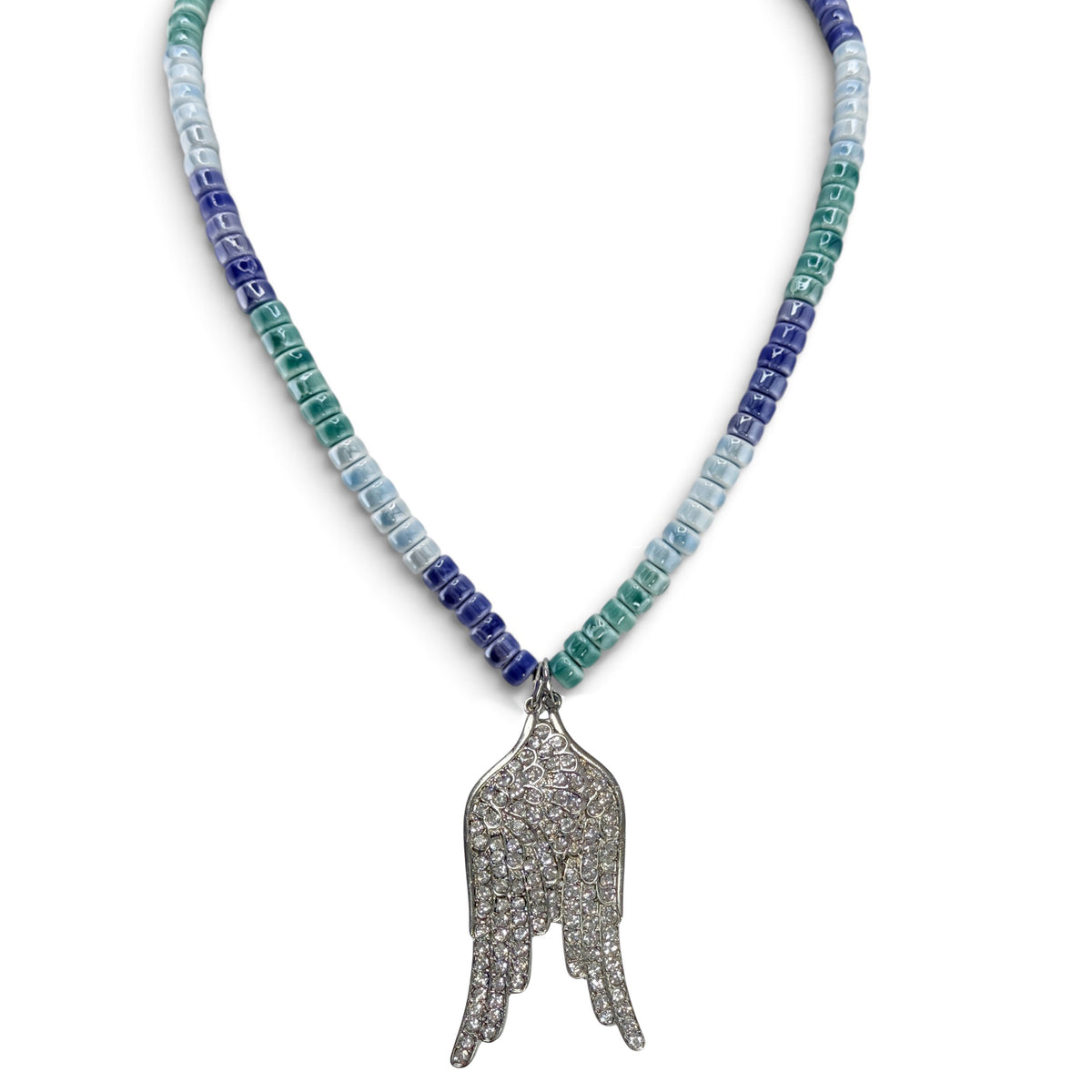 Celeste Angel Wing Ceramic Beaded Necklace in Coastal Sky with blue green ceramic rondelle beads and oversized silver crystal angel wing pendant