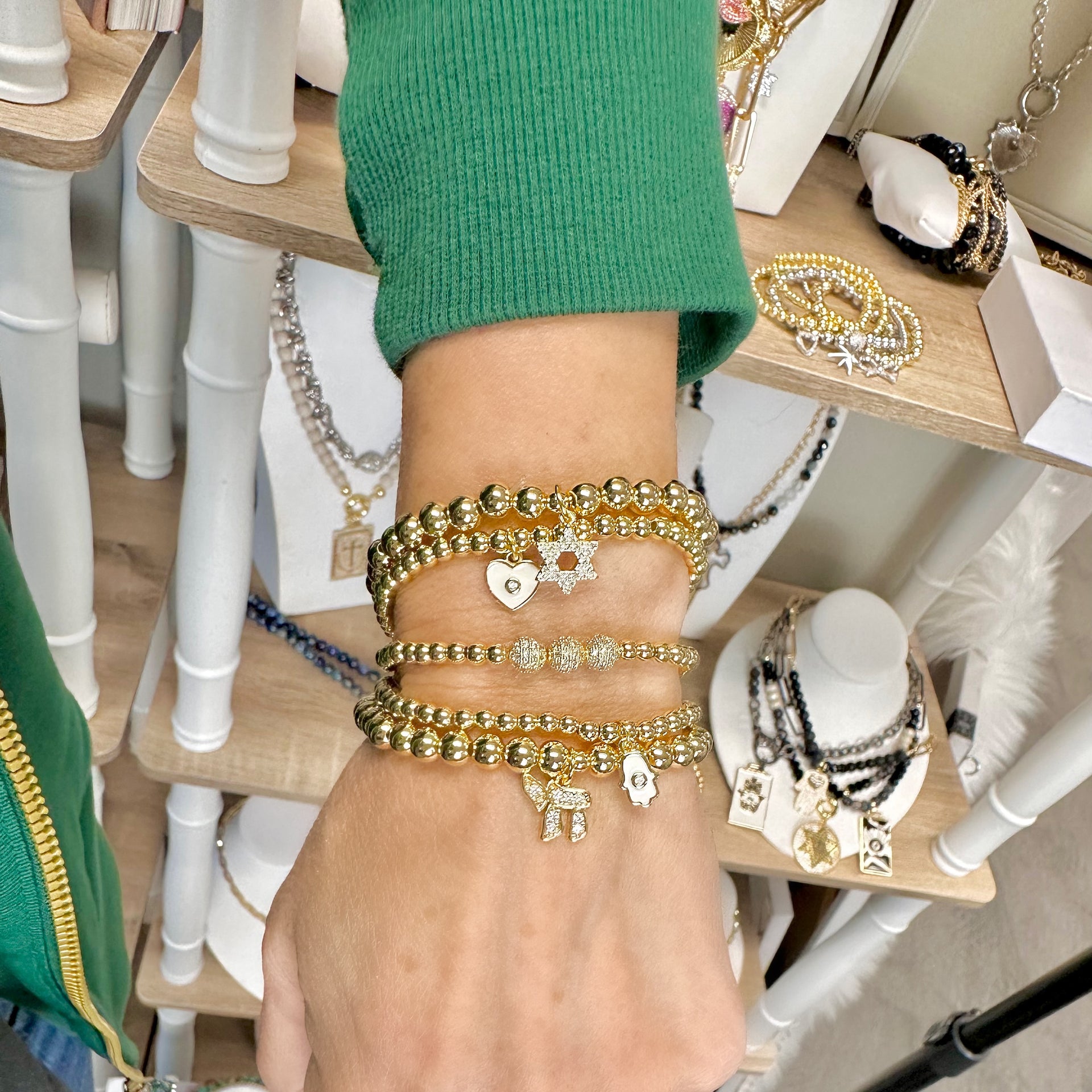 Love Lisa chai evil eye hamsa bracelet stack worn on wrist