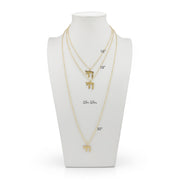love lisa chai pendant necklace layered gold and silver chai symbol necklaces on display with size lengths