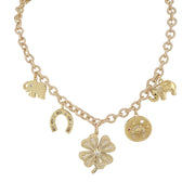 A gold-colored necklace with a chain design, featuring a four-leaf clover, horseshoe, and elephant charms.
