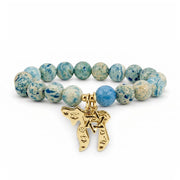 Love Lisa Chaya Chai & Star of David Gemstone Bracelet with blue fossil gemstone beads, gold Chai pendant, and Star of David charm