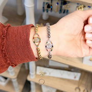 hand showing off the cheryl evil eye in gold