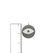 Chloe Evil Eye Charm in silver with pavé crystals shown next to ruler for size reference