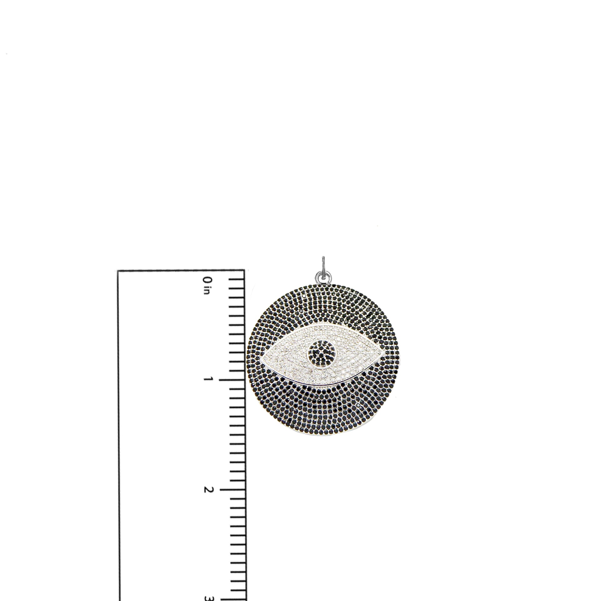 Chloe Evil Eye Charm in silver with pavé crystals shown next to ruler for size reference