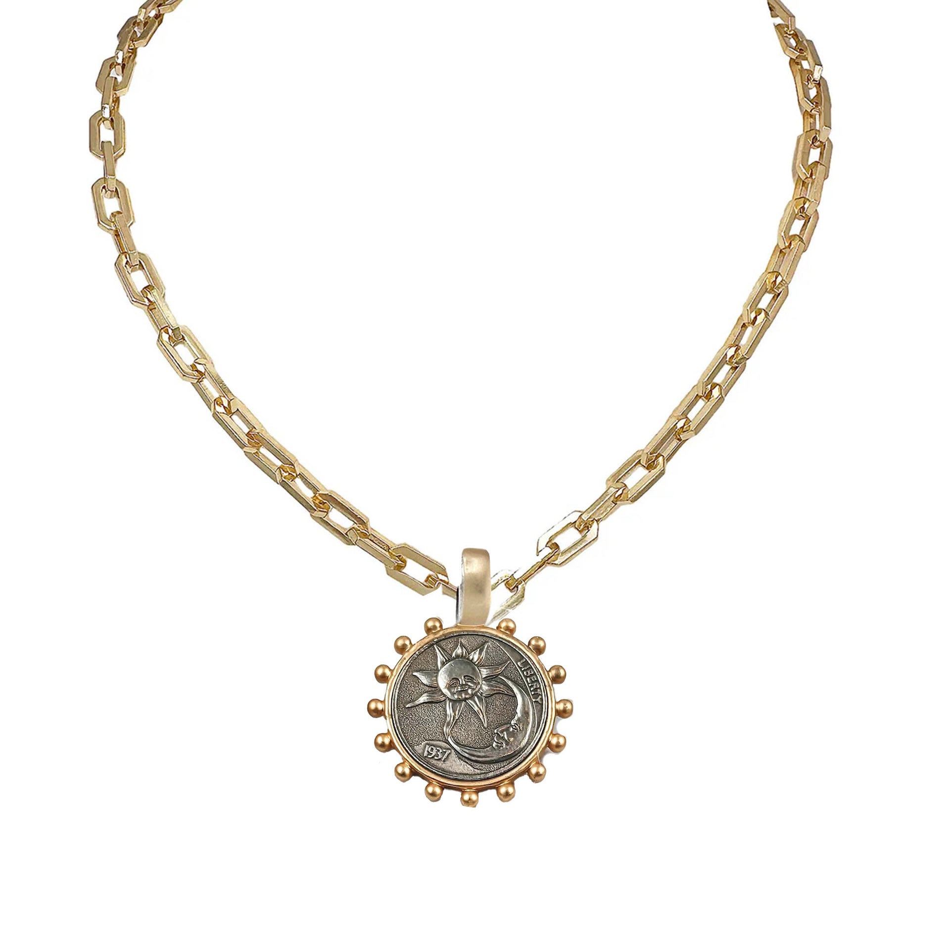 Gold chain necklace with a round  coin moon sun pendant on a white background
