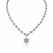 Necklace with star-shaped pendant on a white background