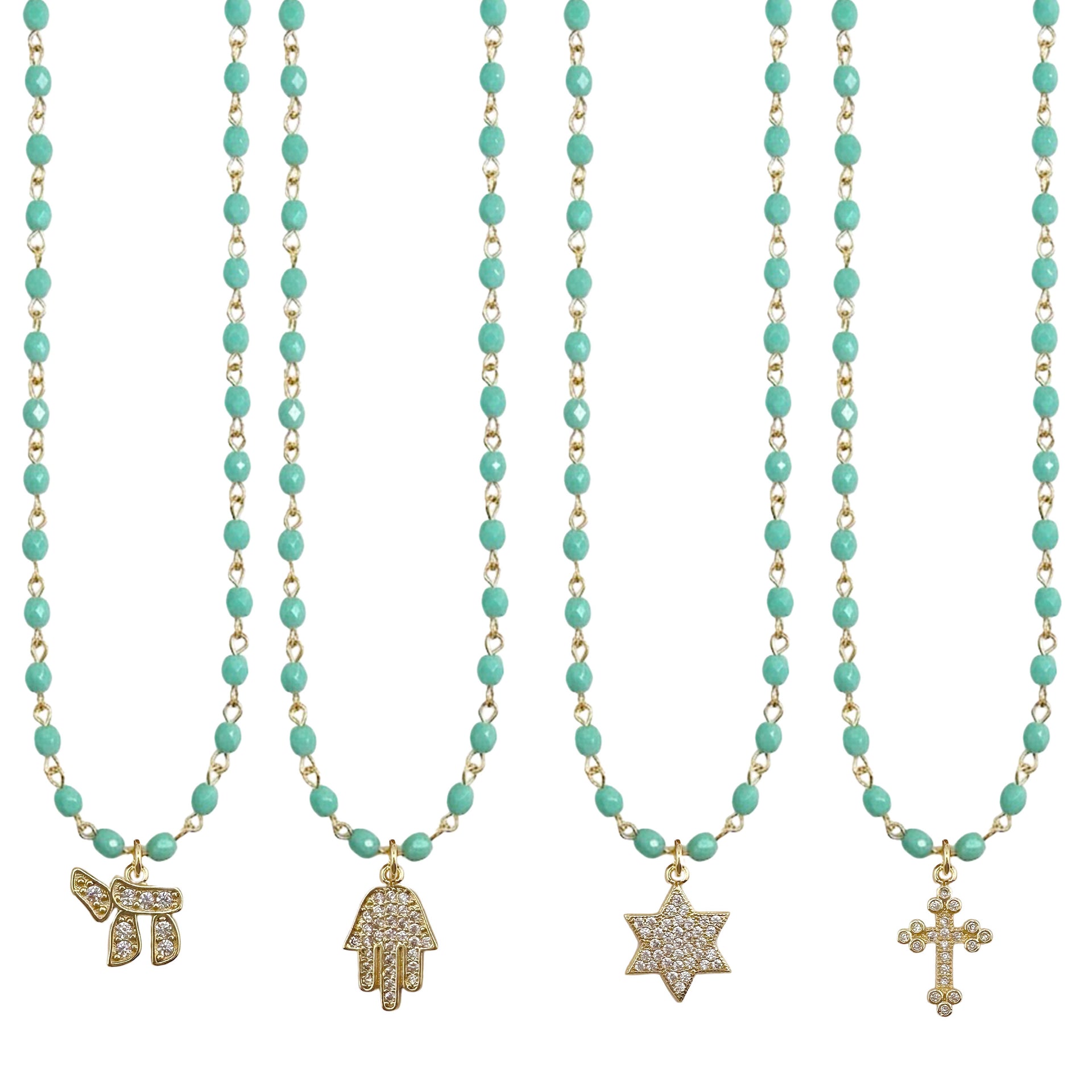 Turquoise beaded necklaces with gold charms on a white background