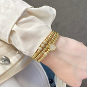 diana sweet little mini pave beaded bracelet gold stacked on wrist with other love lisa beaded bracelets