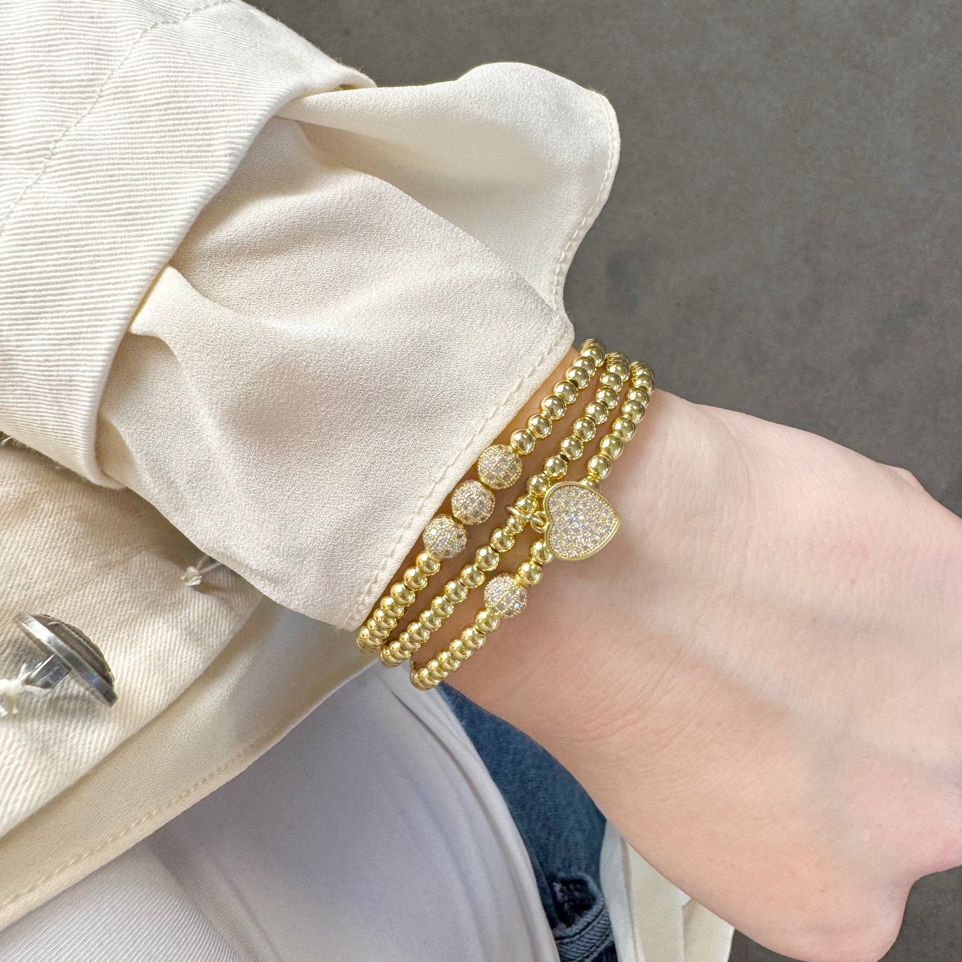 diana sweet little mini pave beaded bracelet gold stacked on wrist with other love lisa beaded bracelets