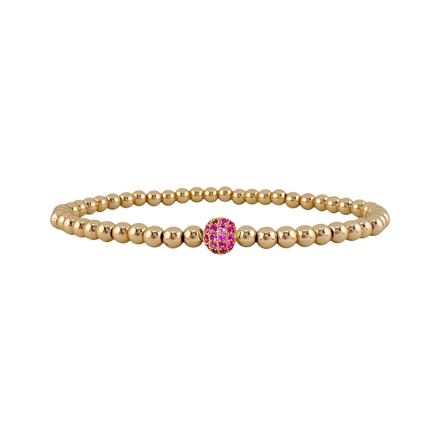 Gold beaded bracelet with a pink gemstone on a white background