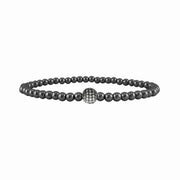Black beaded bracelet with a silver clasp on a white background