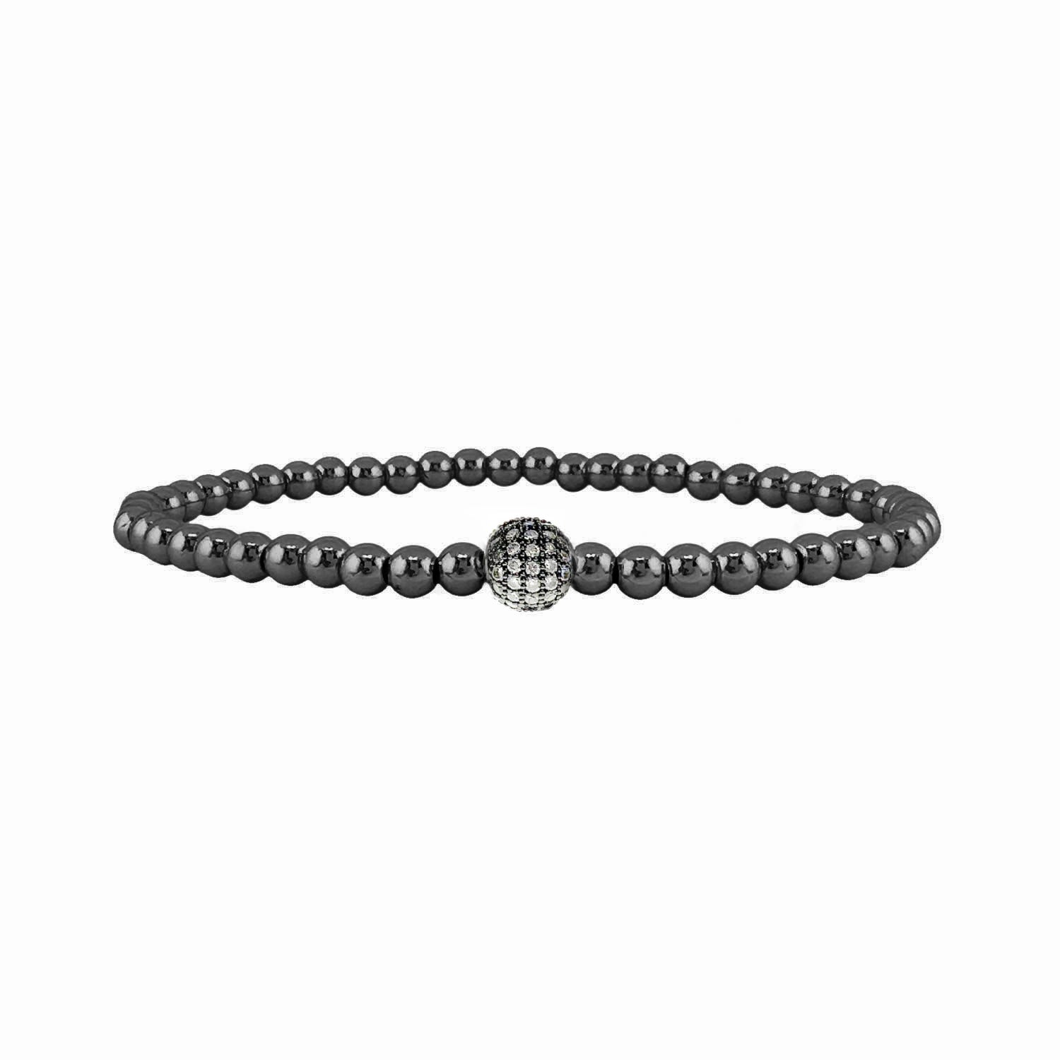 Black beaded bracelet with a silver clasp on a white background