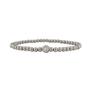 Silver beaded bracelet with a clasp on a white background
