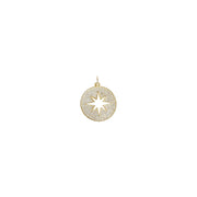 Gold disc charm with starburst cutout and crystal pavé