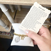 Love Lisa Don't Quit Saint Jude Butterfly Bracelet shown with prayer card