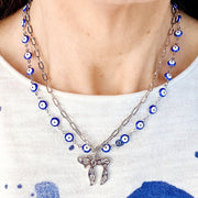 Love Lisa Eden chai evil eye necklace worn showing layered chains and collarbone fit
