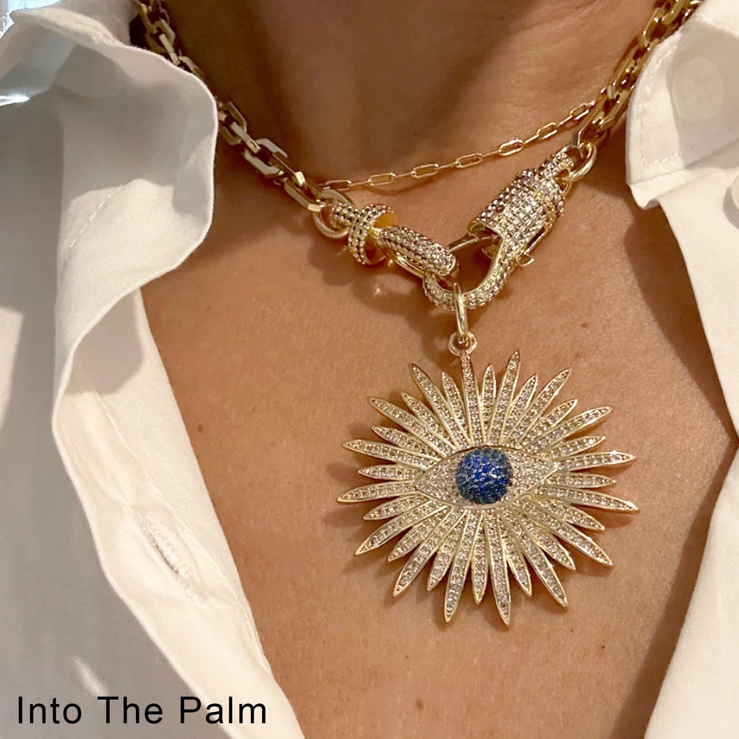 elaine elegant flower evil eye necklace gold pendant worn on model neck
