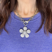 Model wearing Elegant Large Flower Charm styled on a clasp necklace