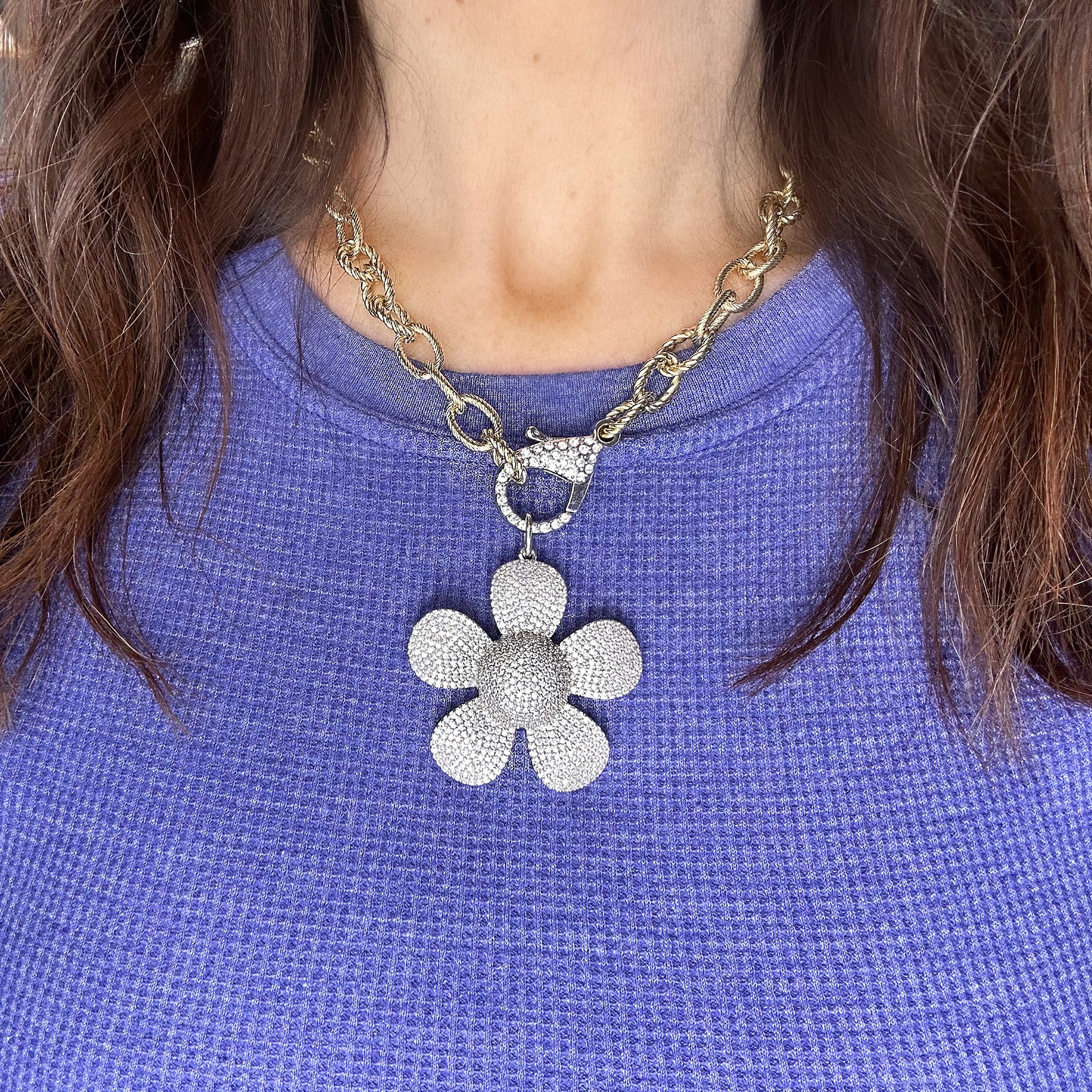 Model wearing Elegant Large Flower Charm styled on a clasp necklace