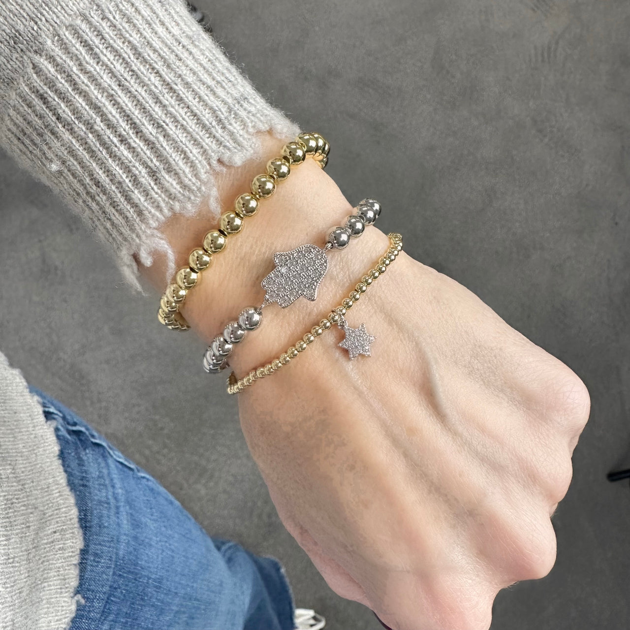 emily hamsa star of david stack on wrist faith jewelry love lisa