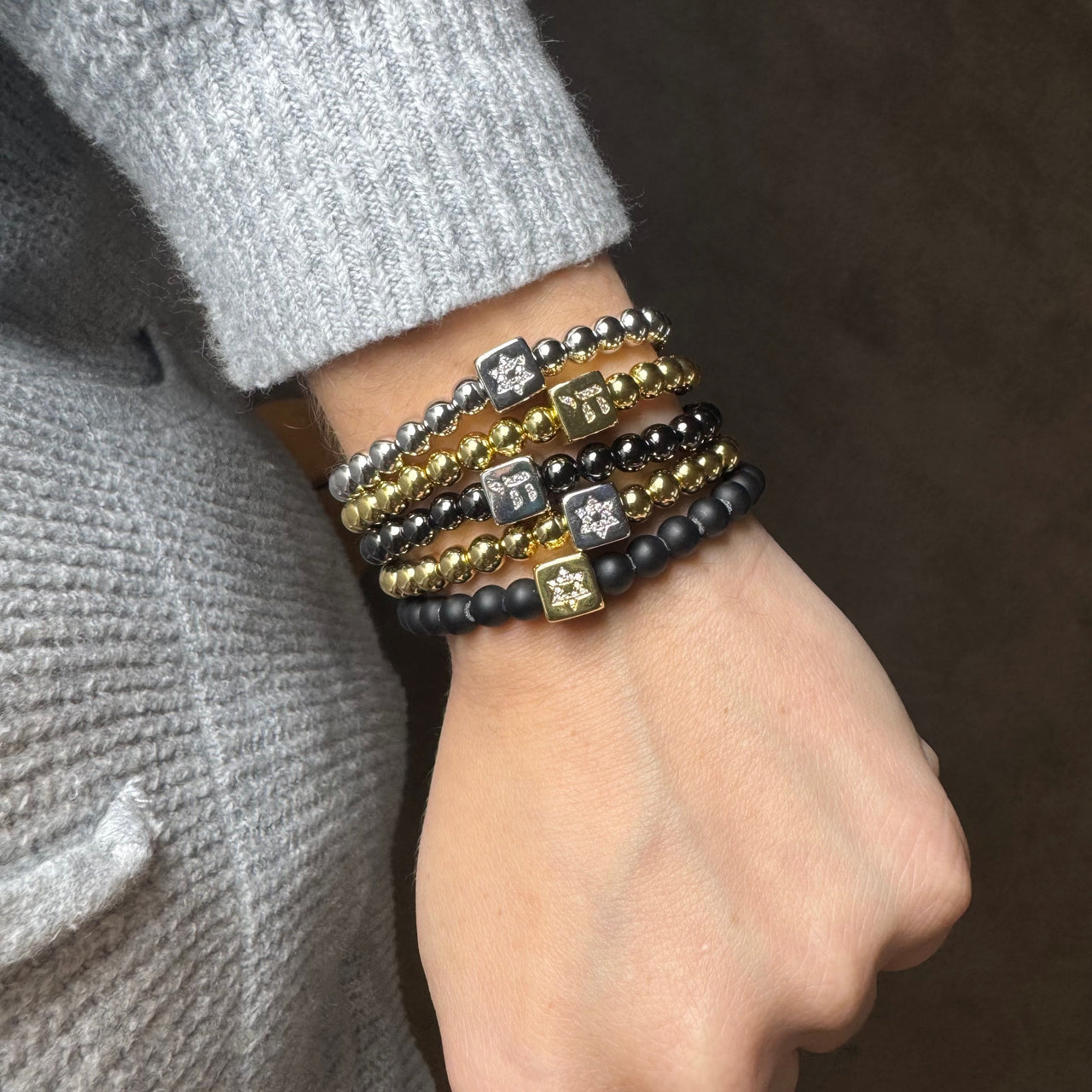 Love Lisa Emily star of david and chai luxe block bracelet worn on wrist layered faith jewelry