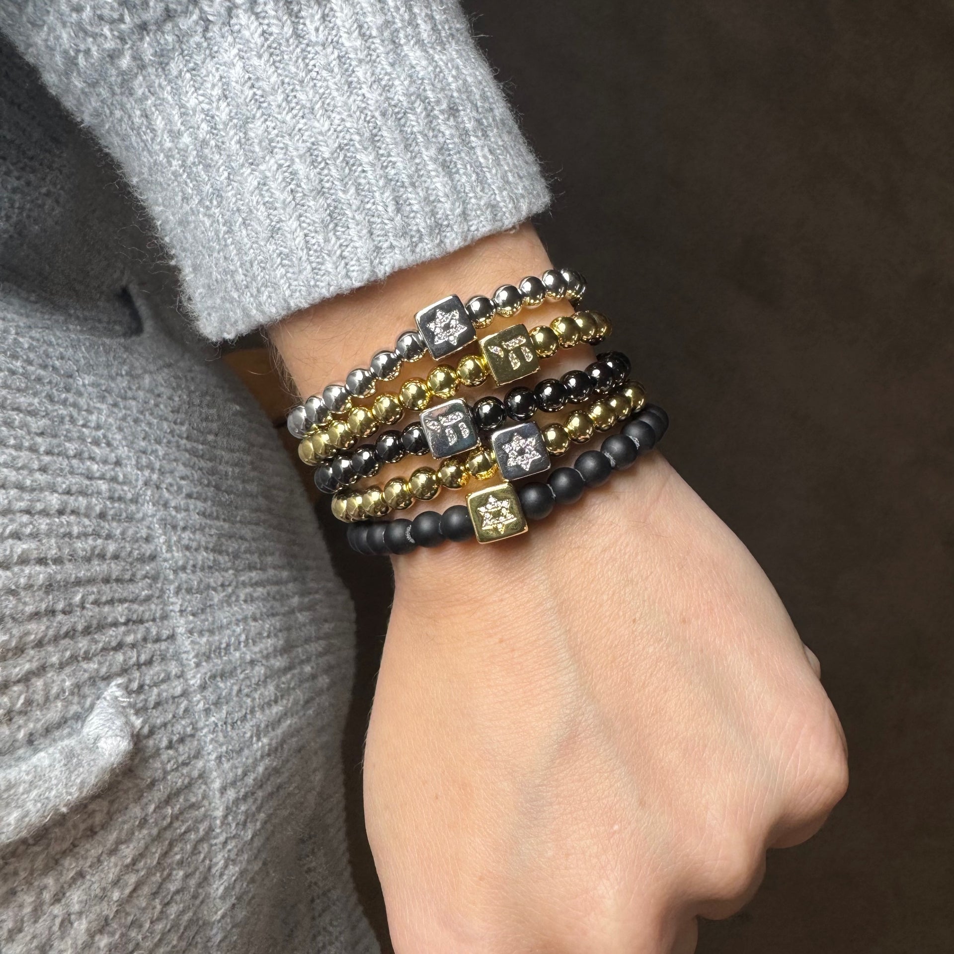 Love Lisa Emily star of david and chai luxe block bracelet worn on wrist layered faith jewelry