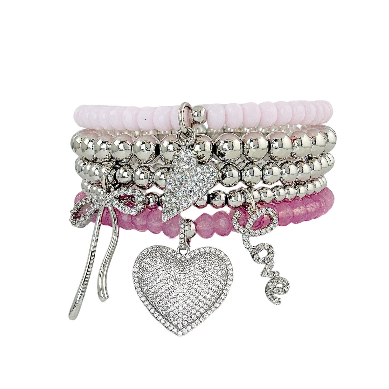 Emmy Heart Bracelet Stack misty rose and silver stretch bracelets with pavé hearts love and bow charms