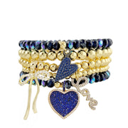 Love Lisa Emmy Heart Bracelet Stack navy glow gold bead stretch bracelets with pavé heart love and bow charms