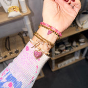 Emmy Heart Bracelet Stack pink lemonade gold tone bead bracelets with hearts, love and bow charms