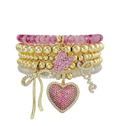Emmy Heart Bracelet Stack pink lemonade gold tone bead bracelets with pave hearts, bow and love charms