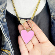 Bold pink and gold enamel heart charm necklace detail