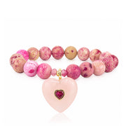 Endless Heat Gemstone Heart Beaded Bracelet in Pink with fossil gemstone beads, gold-tone accents, and gemstone heart pendant with crystal heart detail