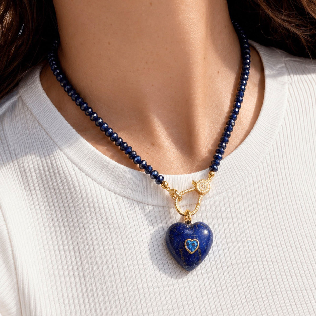 Love Lisa navy crystal clasp necklace worn with blue lapis heart charm gold easy open clasp and faceted bead necklace styling