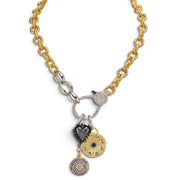 Love Lisa Estelle Celestial Charm Necklace with gold-tone link chain, mixed-metal moon, heart, and evil eye charms, and sparkling statement clasp