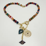Full view of Love Lisa Estelle Gemstone Charm Necklace with faceted mixed agate beads, celestial medallion, dimensional heart, sparkling evil eye, and mixed-metal details