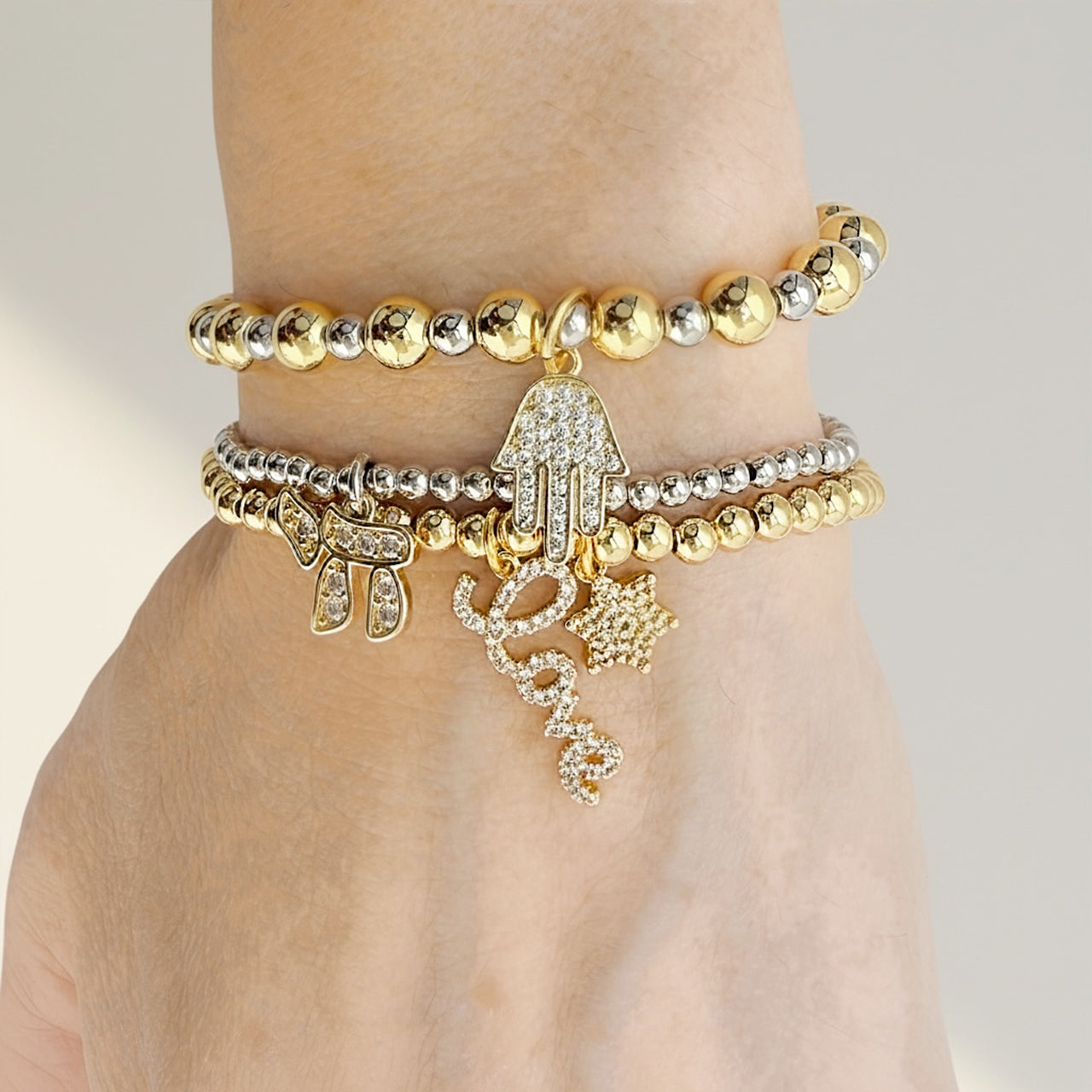 Love Lisa Eternal Blessing bracelet stack Gold Silver on model