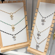 Eternal Chai Necklaces by Love Lisa displayed on jewelry stand in multiple bead colors