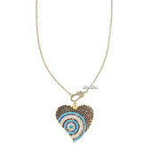 Gold heart evil eye charm with black enamel and pavé blue crystal detail