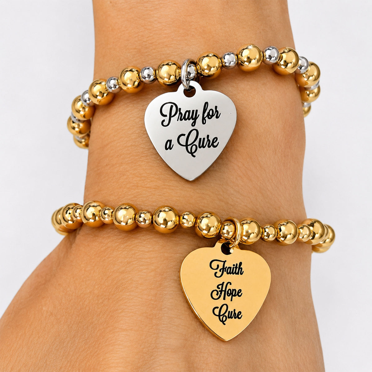 Love Lisa Faith Hope Cure reversible T1D awareness bracelet worn on wrist in a gold and silver bracelet stack