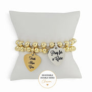 Love Lisa Faith Hope Cure reversible bracelet displayed on pillow showing Pray for a Cure heart charm message