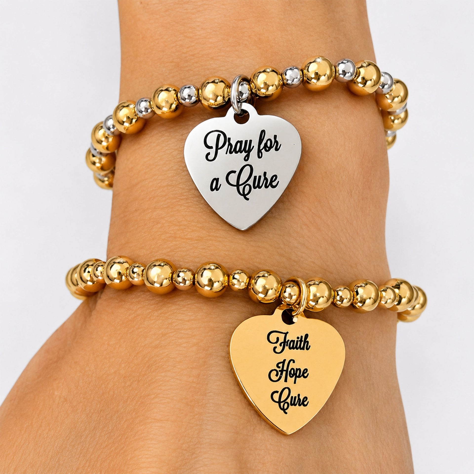 Love Lisa Faith Hope Cure reversible T1D awareness bracelet worn on wrist in a gold and silver bracelet stack