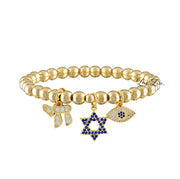 gold faith and protection charm bracelet with 6mm beads blue pave star of david chai charm and evil eye charm