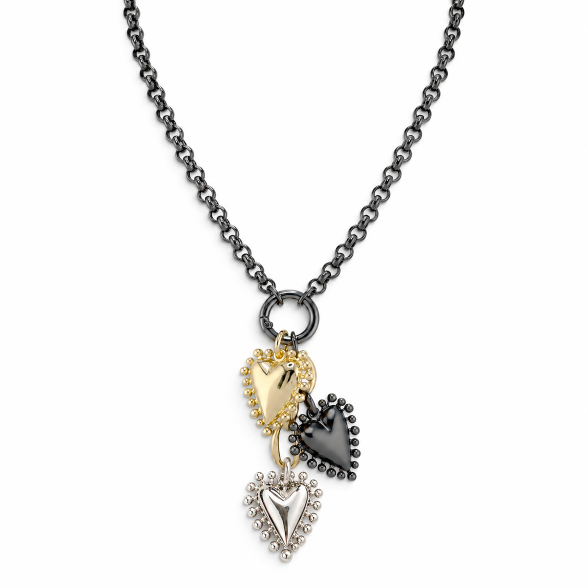 Falling Hearts Trio Necklace in gunmetal with three textured mixed metal heart charms hanging from a center ring