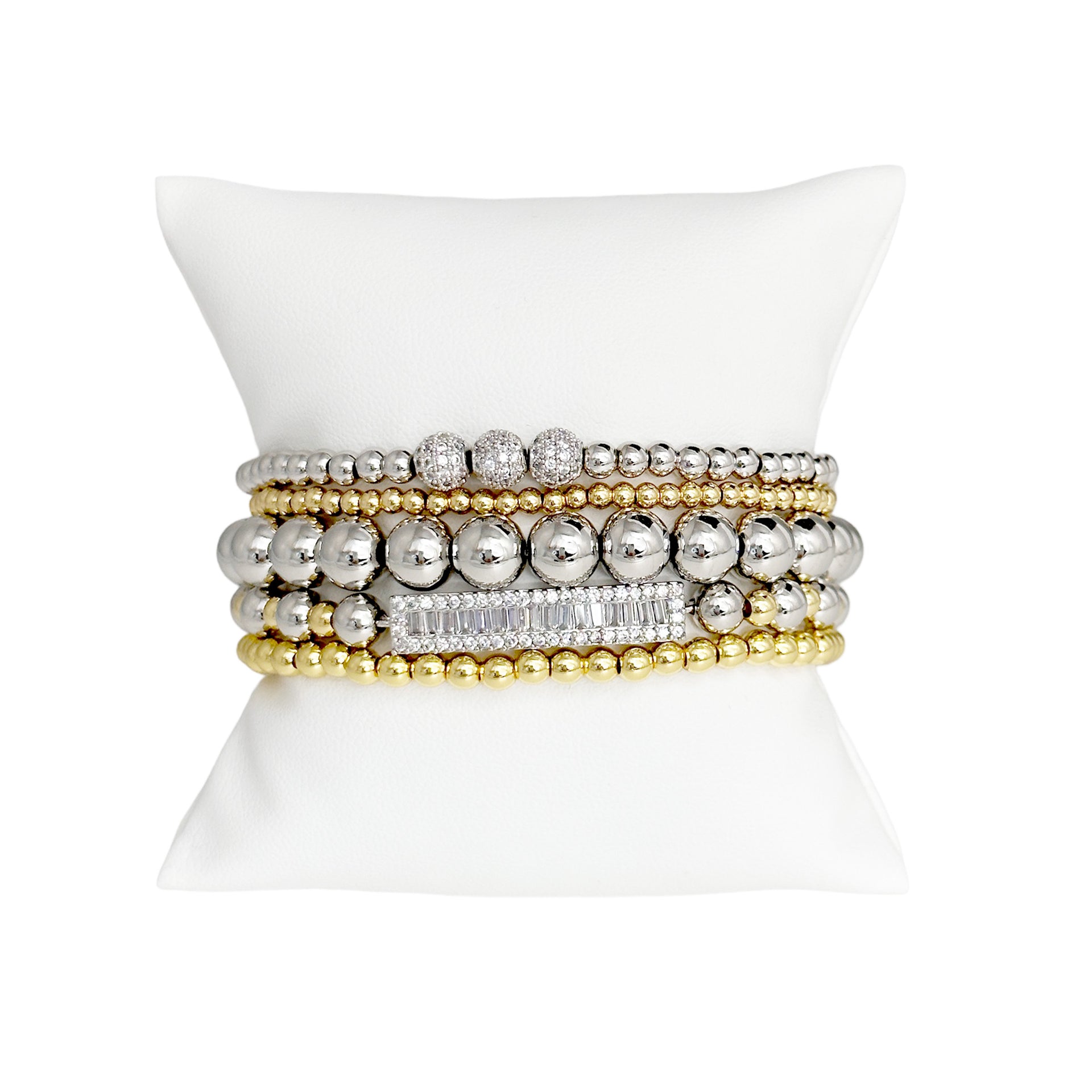 love lisa fancy celebrity five stack bracelet collection gold and silver beaded stack on display pillow