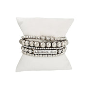 love lisa fancy celebrity five stack bracelet collection silver beaded and baguette bracelets on pillow