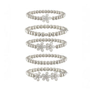 felicity flower bracelets all layered individually on a white background